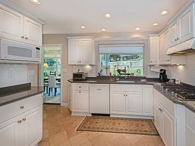 a kitchen with a stove a sink and a refrigerator