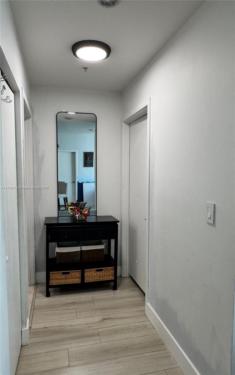 1111 Southwest 1st Avenue, Unit 2823N Miami, FL 33130 - Photo 4 of 22 a living room with furniture and a mirror