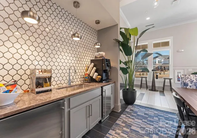 a kitchen with sink cabinets and wooden floor