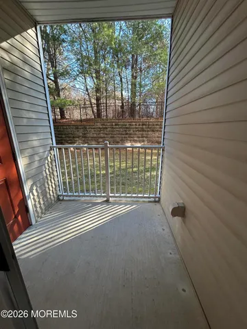 a view of a balcony with an outdoor space