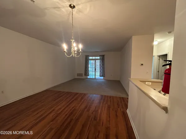 a view of a kitchen from the hallway