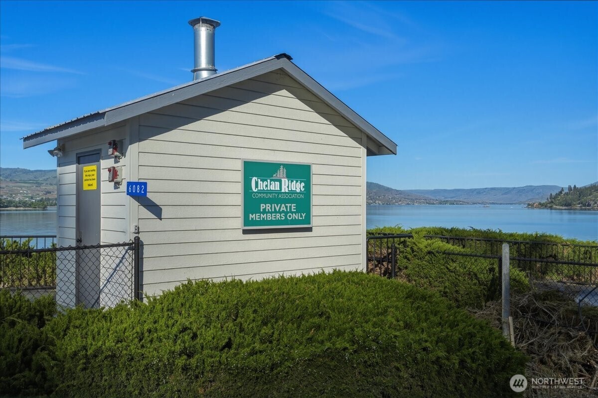 7365 Ridgeview Drive Chelan, WA 98816 - Photo 14 of 17 a view of a house with a yard