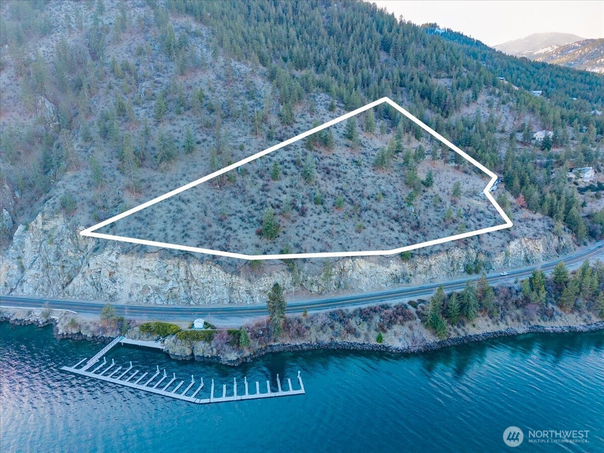 7365 Ridgeview Drive Chelan, WA 98816 - Photo 3 of 17 a view of a swimming pool with a yard