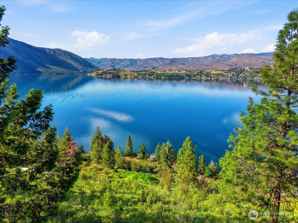 7365 Ridgeview Drive Chelan, WA 98816 - Photo 9 of 17 a view of a lake with a mountain in the background