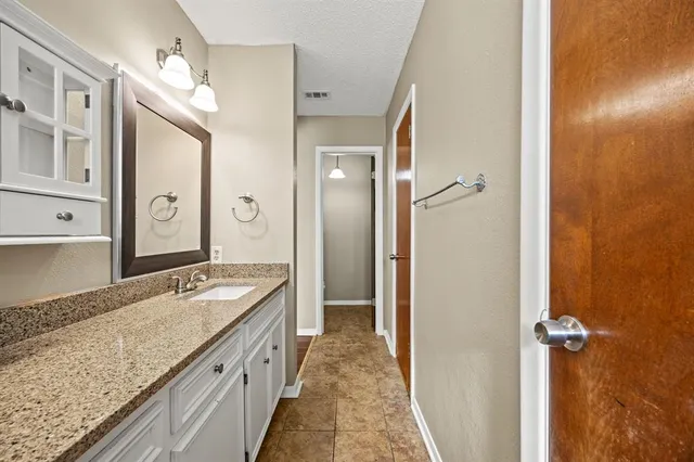 a view of walk in closet with white walls