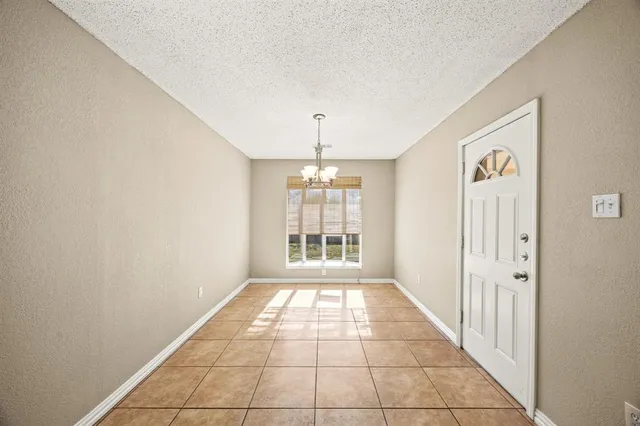 a view of a hallway with windows