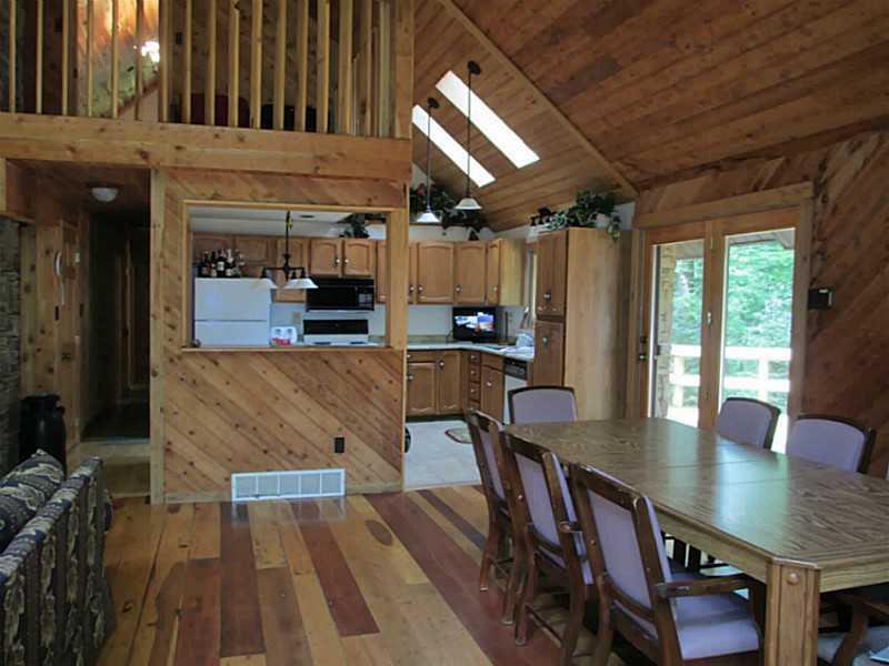 147 Fire Tower Road Champion, PA 15622 - Photo 4 of 21 Great Room. Dining area and you can see small loft above!