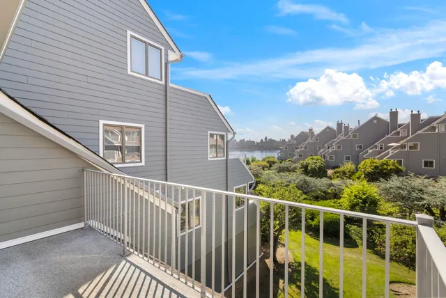 a view of a balcony with two chairs