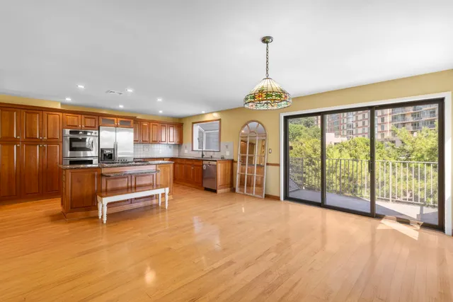 a view of a living room and kitchen with a large window