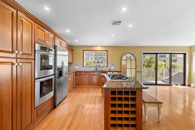 a view of kitchen with furniture and large window