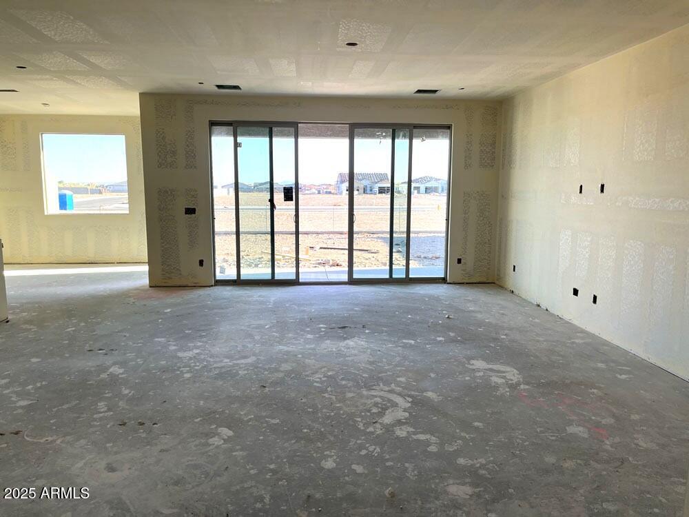 7631 West Tether Trail Peoria, AZ 85383 - Photo 3 of 14 a view of an empty room with a window