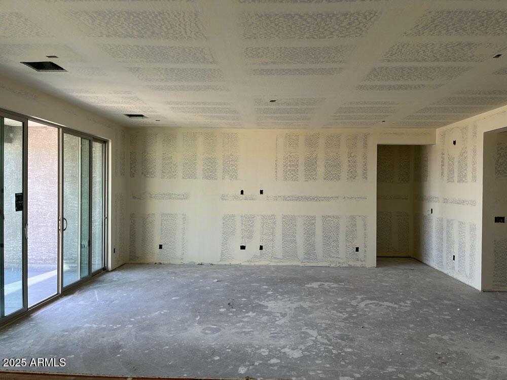 7631 West Tether Trail Peoria, AZ 85383 - Photo 4 of 14 an empty room with an entryway door