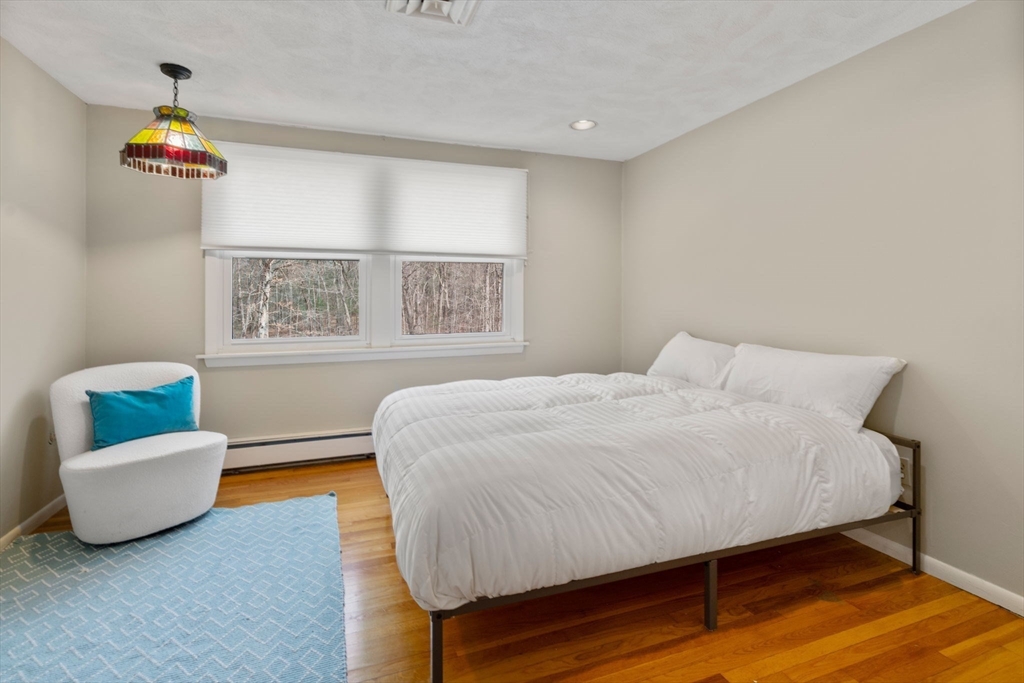 80 Oak Hill Drive Sharon, MA 02067 - Photo 17 of 36 a bed room with a bed and a couch