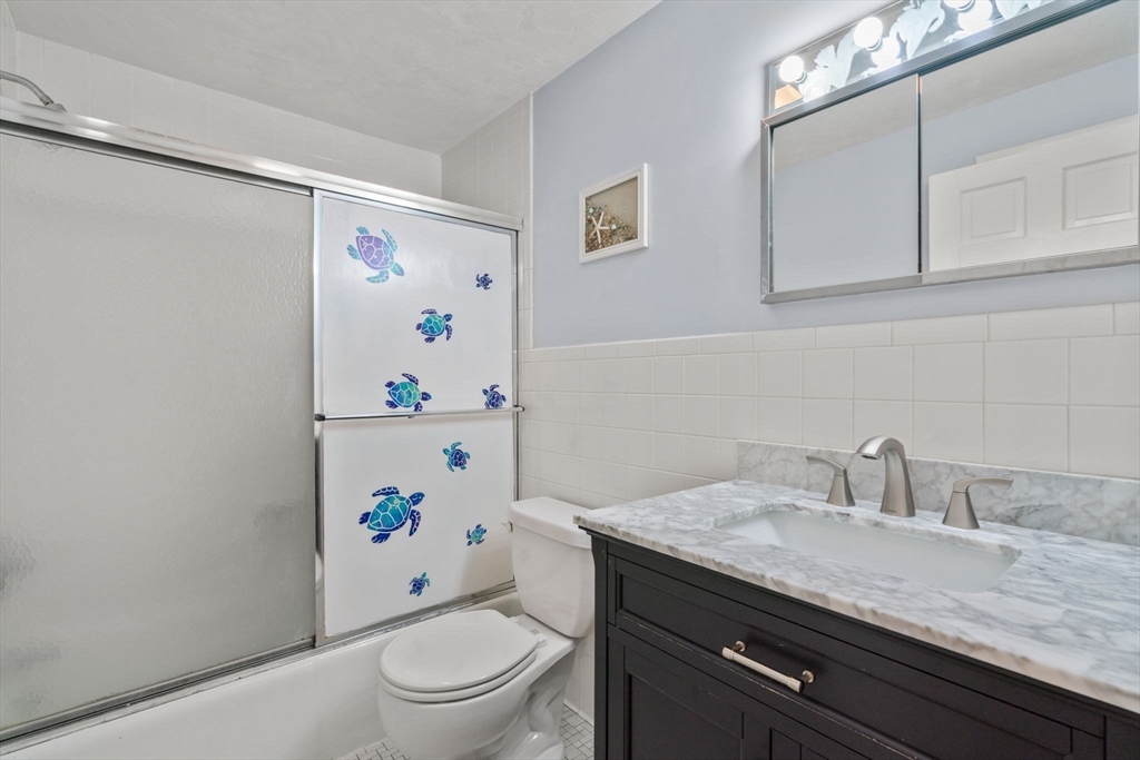 80 Oak Hill Drive Sharon, MA 02067 - Photo 20 of 36 a bathroom with a granite countertop toilet sink and mirror