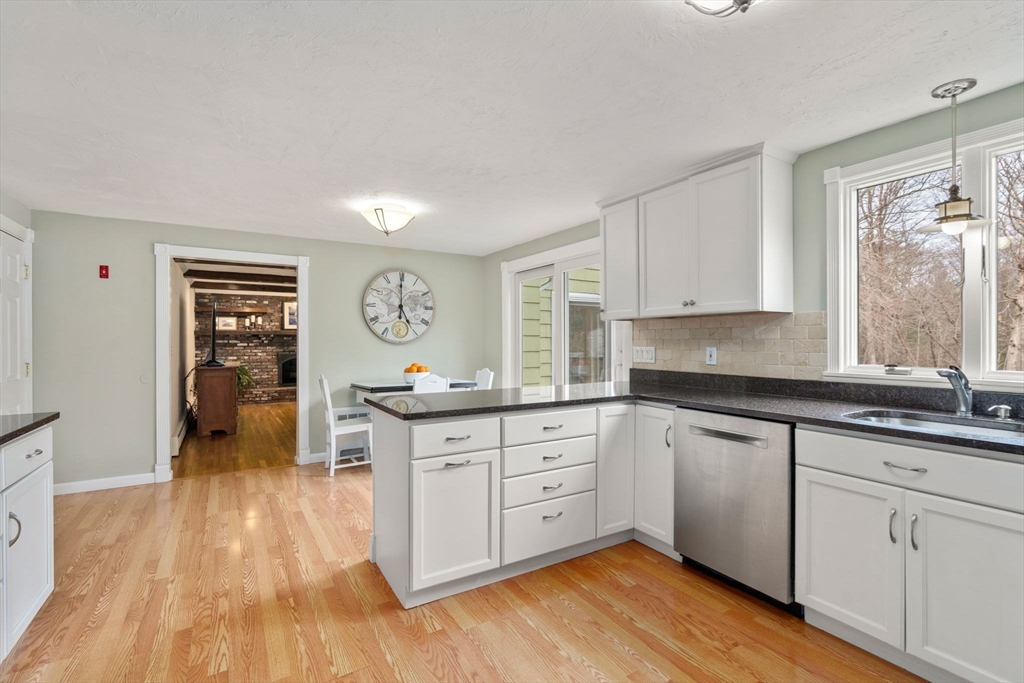 80 Oak Hill Drive Sharon, MA 02067 - Photo 5 of 36 a large kitchen with cabinets wooden floor and stainless steel appliances