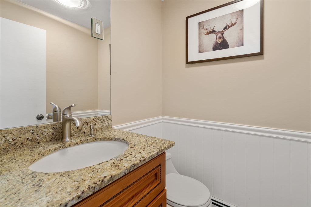 80 Oak Hill Drive Sharon, MA 02067 - Photo 7 of 36 a bathroom with a granite countertop sink and a mirror