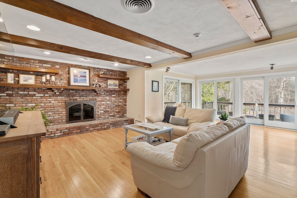 80 Oak Hill Drive Sharon, MA 02067 - Photo 8 of 36 a living room with furniture a fireplace and a flat screen tv