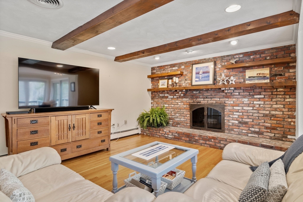 80 Oak Hill Drive Sharon, MA 02067 - Photo 9 of 36 a living room with furniture and a fireplace