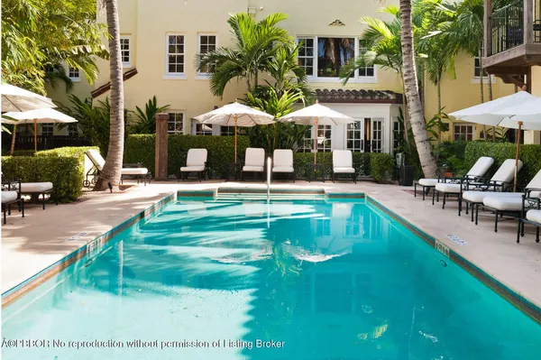 a swimming pool with patio outdoor seating and yard