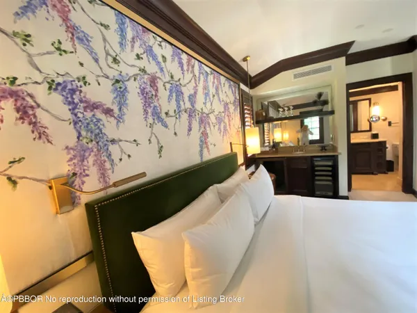 a bed room with a bed and a television