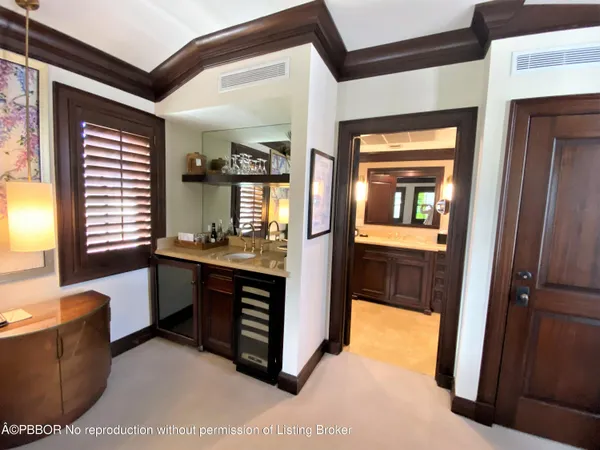 a kitchen with a refrigerator and a sink