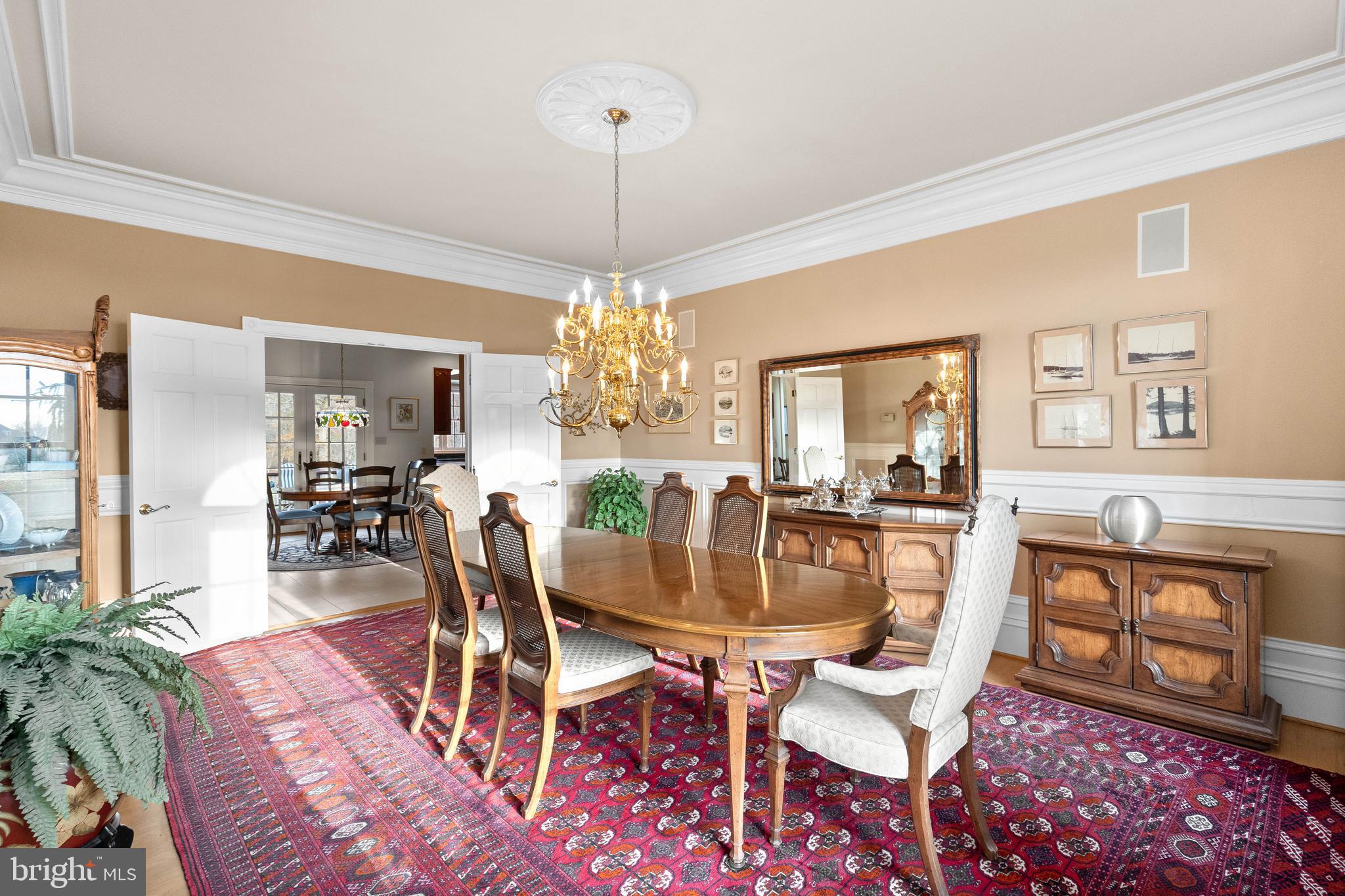 37120 Devon Wick Lane Purcellville, VA 20132 - Photo 14 of 66 a dining room with furniture a chandelier and wooden floor