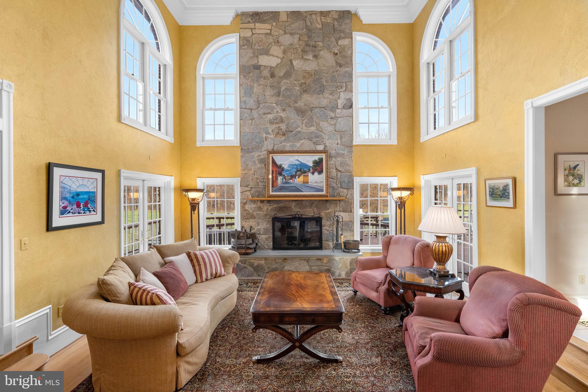 37120 Devon Wick Lane Purcellville, VA 20132 - Photo 17 of 66 a living room with furniture fireplace and a large window