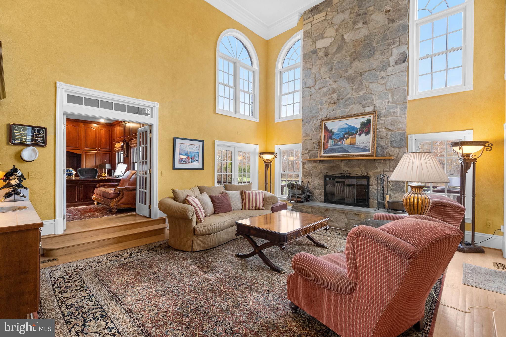 37120 Devon Wick Lane Purcellville, VA 20132 - Photo 18 of 66 a living room with furniture flat screen tv and a fireplace