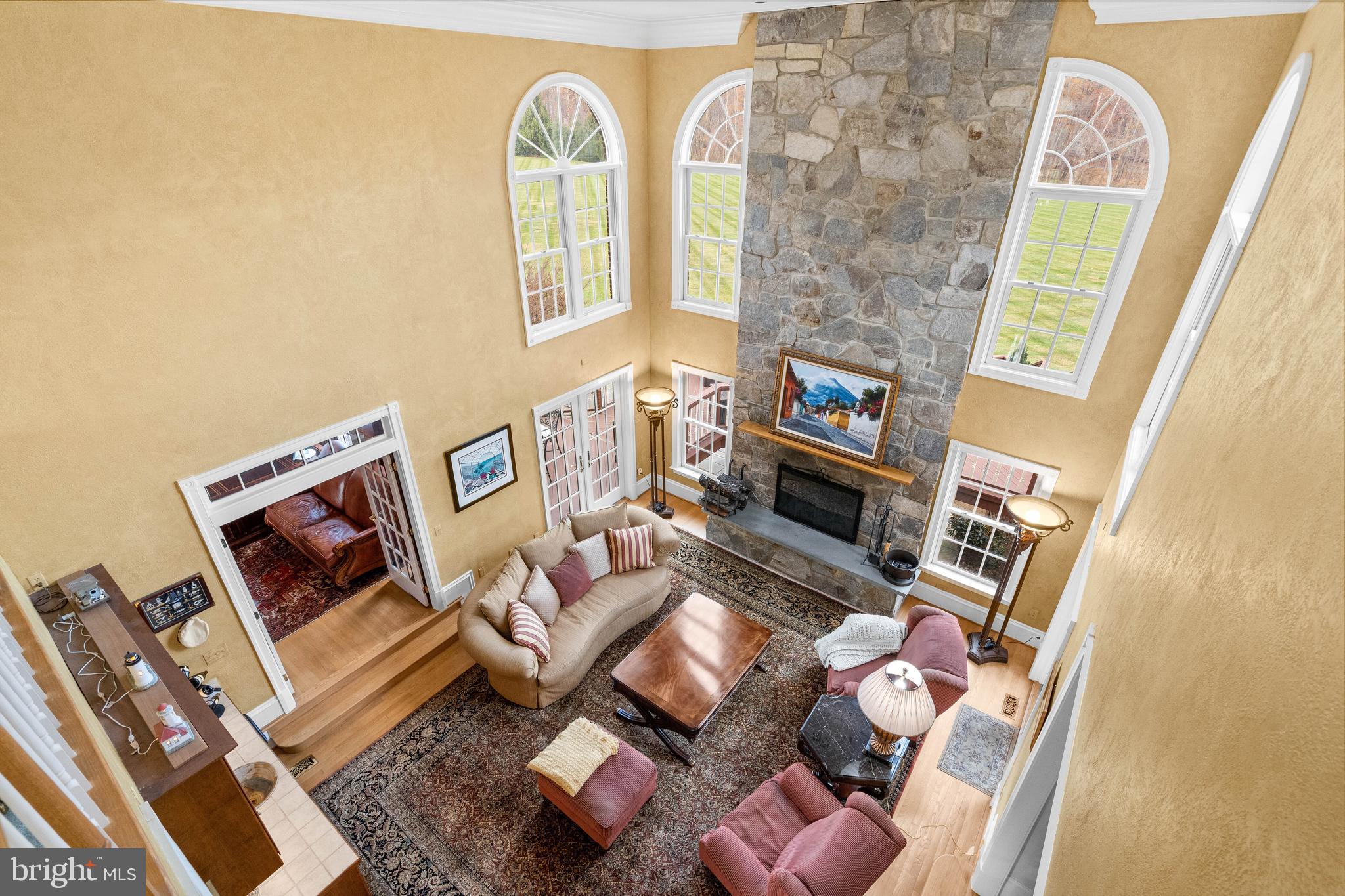 37120 Devon Wick Lane Purcellville, VA 20132 - Photo 21 of 66 a living room with furniture and a fireplace