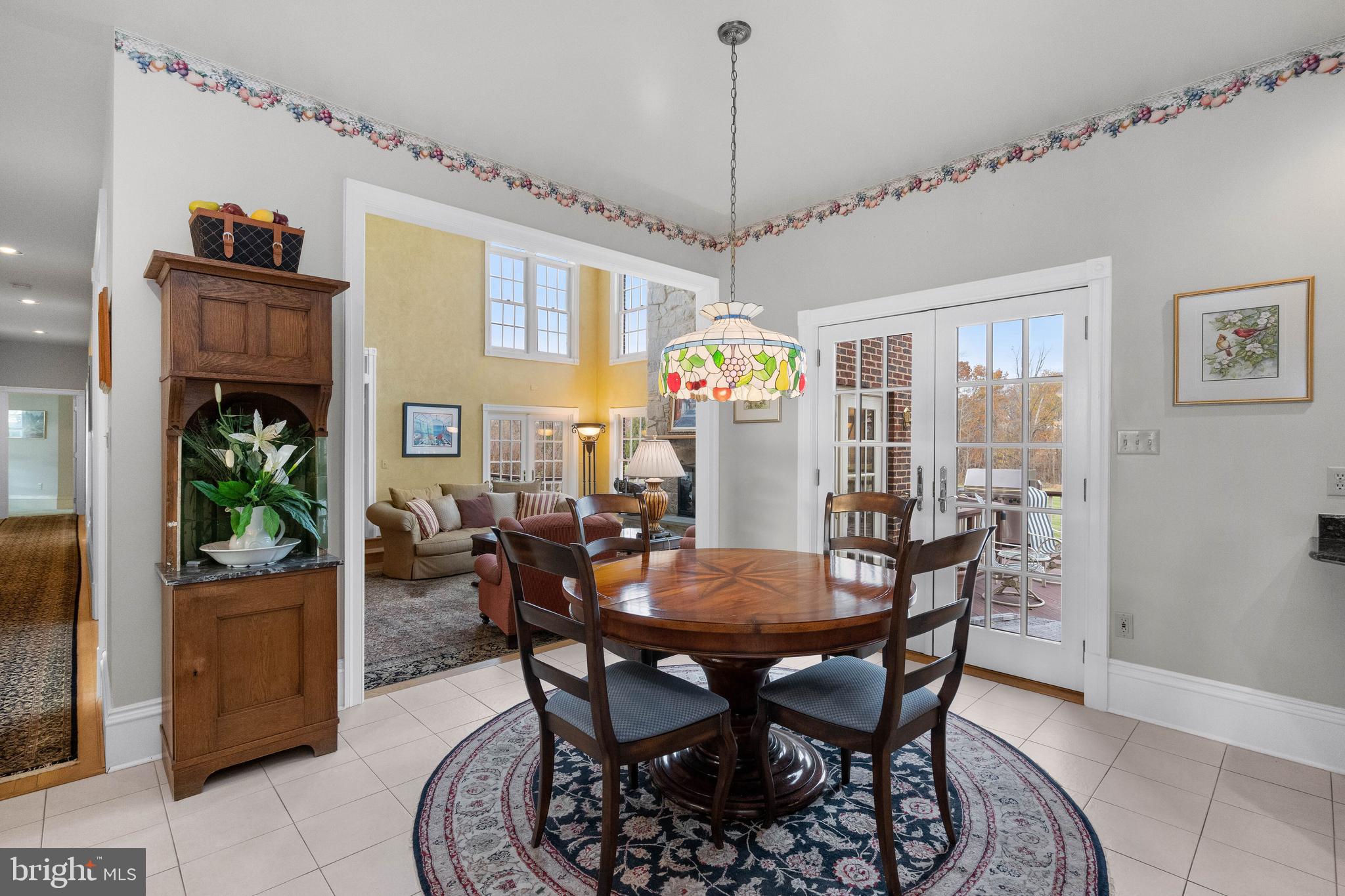 37120 Devon Wick Lane Purcellville, VA 20132 - Photo 24 of 66 a view of a dining room with furniture window and wooden floor