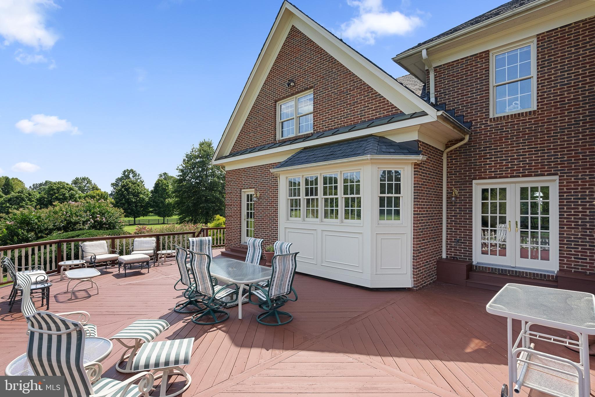 37120 Devon Wick Lane Purcellville, VA 20132 - Photo 31 of 66 a building outdoor space with patio furniture and potted plants