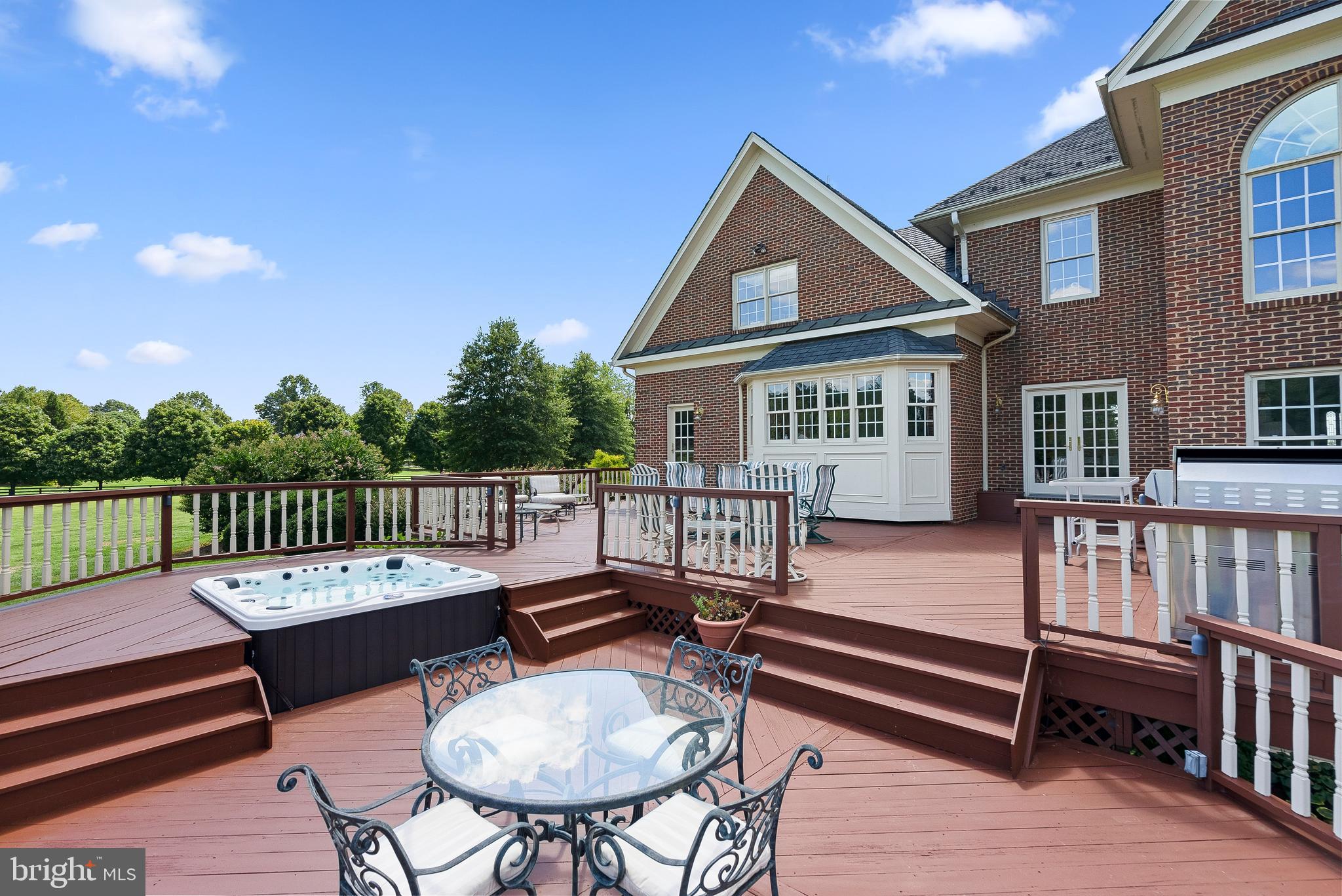 37120 Devon Wick Lane Purcellville, VA 20132 - Photo 32 of 66 a view of a patio with a table