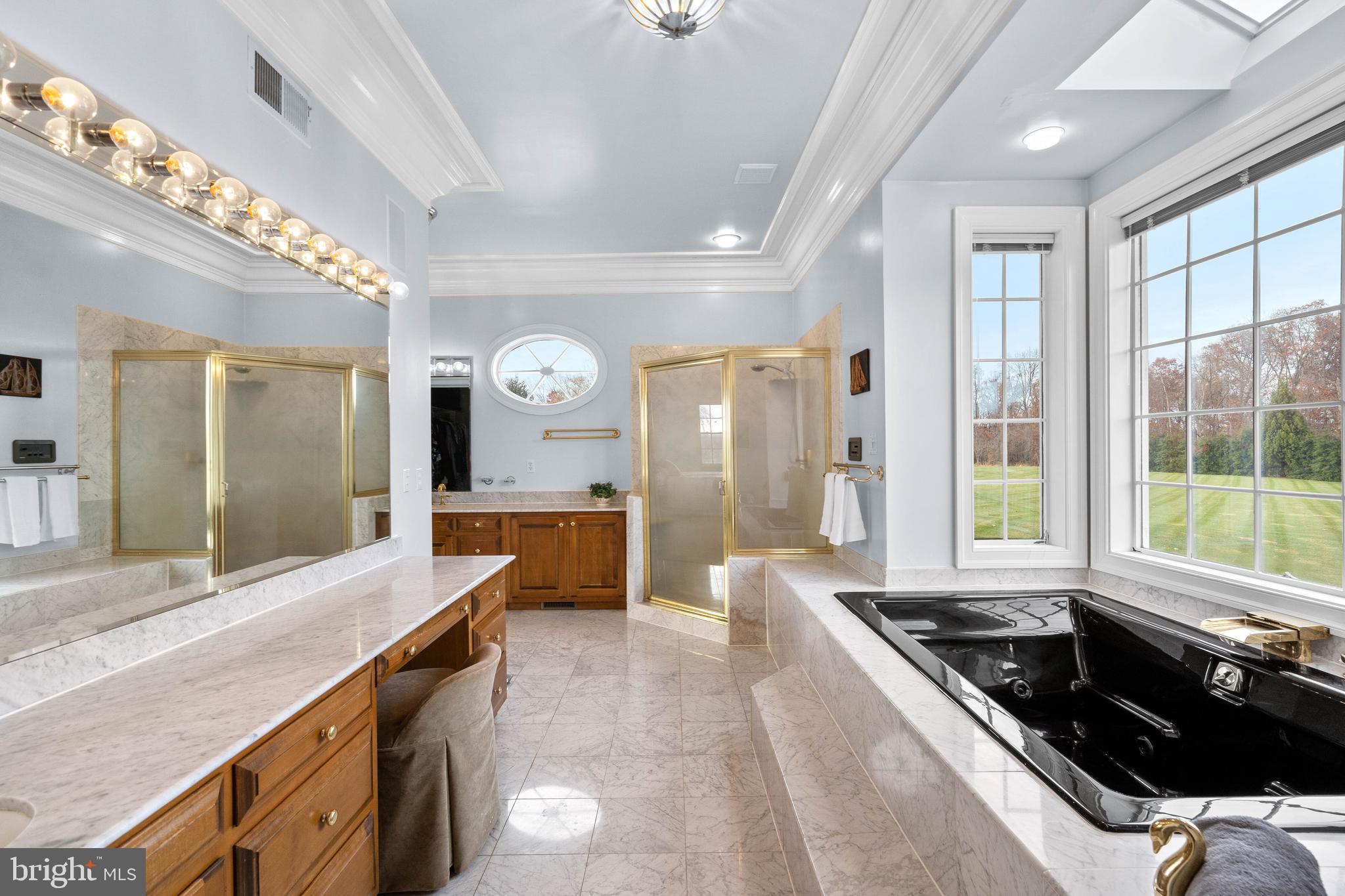 37120 Devon Wick Lane Purcellville, VA 20132 - Photo 36 of 66 a large kitchen with granite countertop a large stove a sink dishwasher and white cabinets with wooden floor