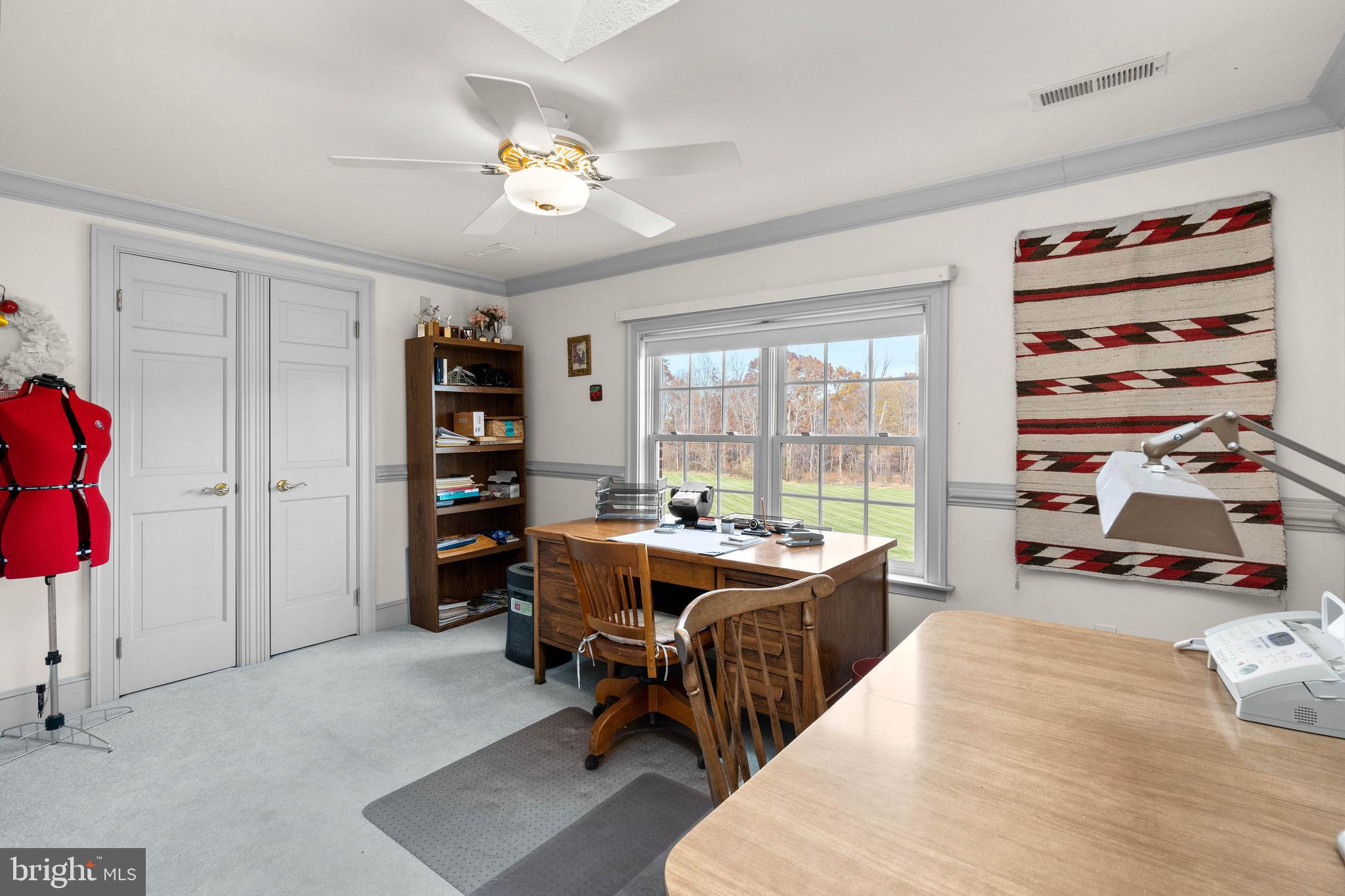 37120 Devon Wick Lane Purcellville, VA 20132 - Photo 39 of 66 a view of a workspace with furniture and a large window