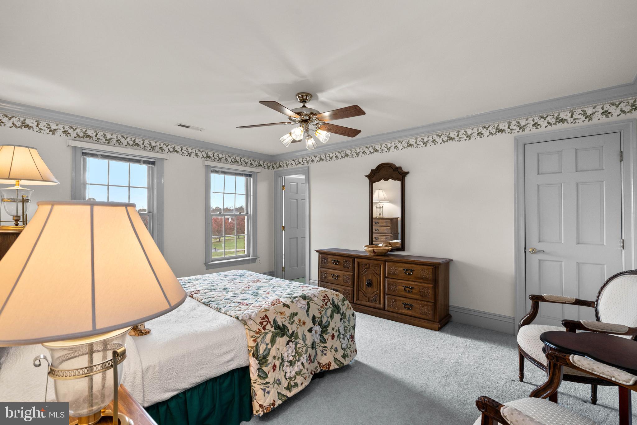 37120 Devon Wick Lane Purcellville, VA 20132 - Photo 42 of 66 a bedroom with a bed and a dresser with mirror