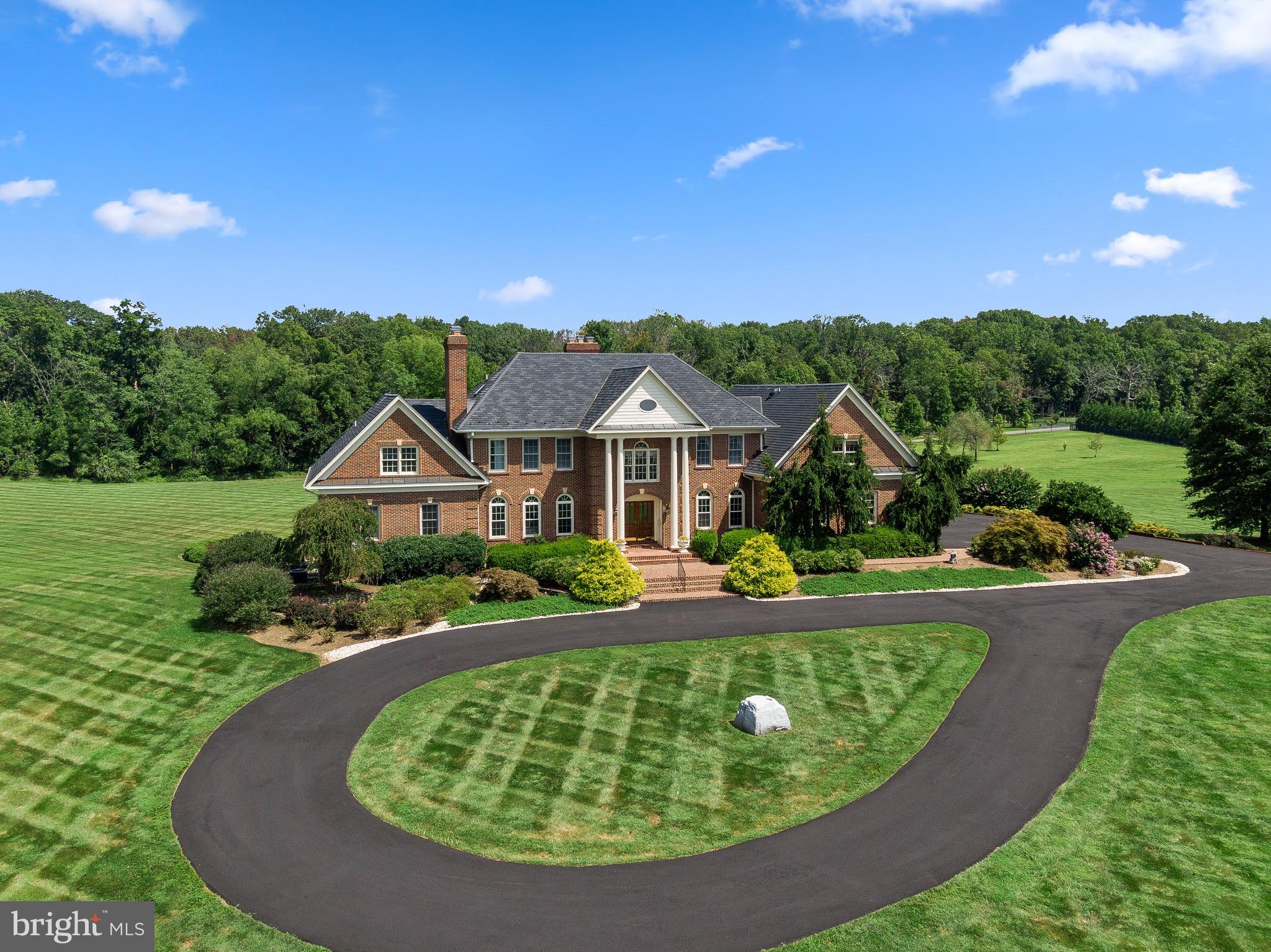 37120 Devon Wick Lane Purcellville, VA 20132 - Photo 8 of 66 a view of a house with a big yard plants and large trees
