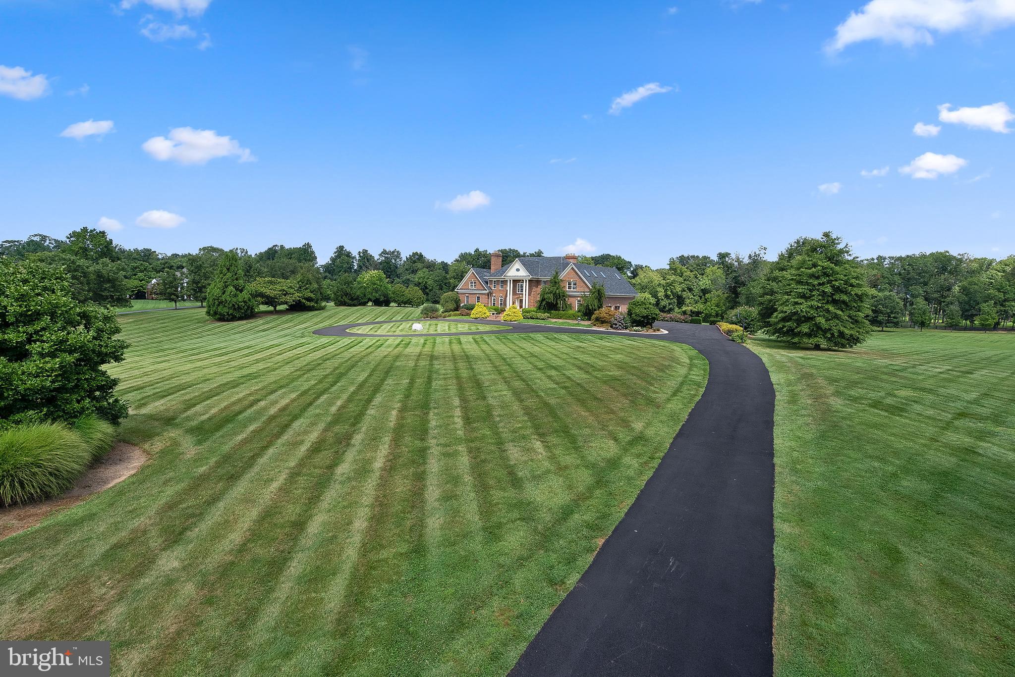 37120 Devon Wick Lane Purcellville, VA 20132 - Photo 9 of 66 a view of a golf course with a garden