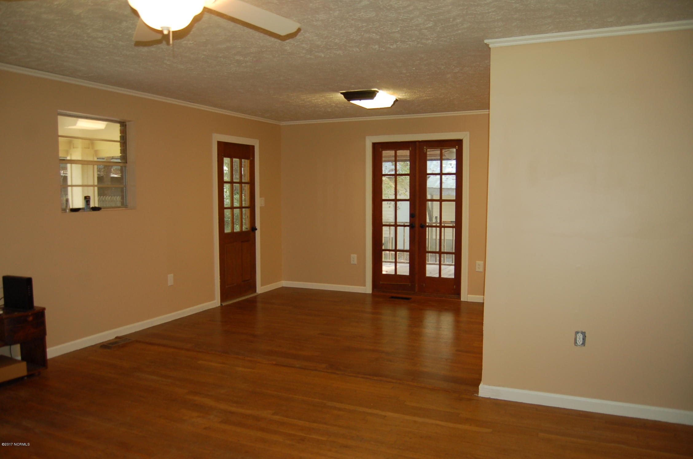 181 Oak Grove Road Newport, NC 28570 - Photo 6 of 17 The living room is open to the dining area,