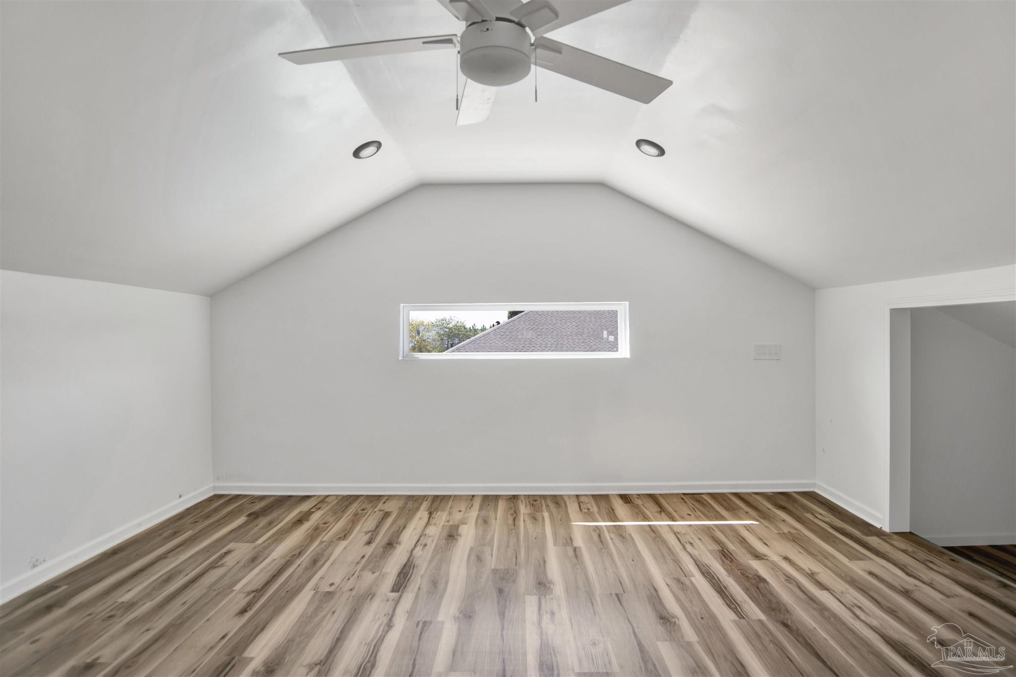 2810 Wallace Lake Road Pace, FL 32571 - Photo 52 of 65 a view of an empty room with wooden floor