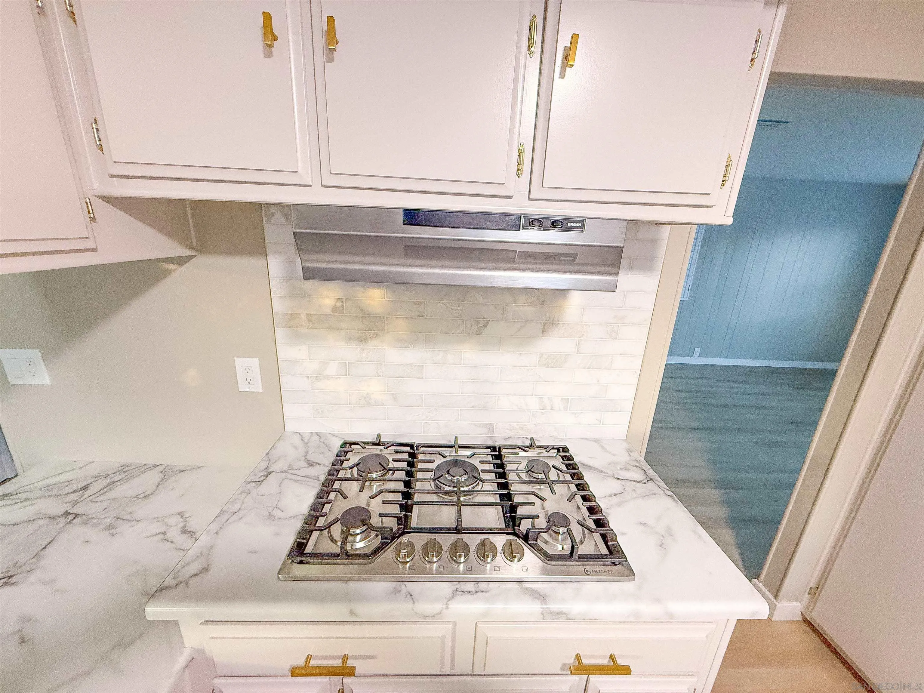 1212 H Street Ramona, CA 92065 - Photo 15 of 31 a stove top oven sitting on a kitchen counter top