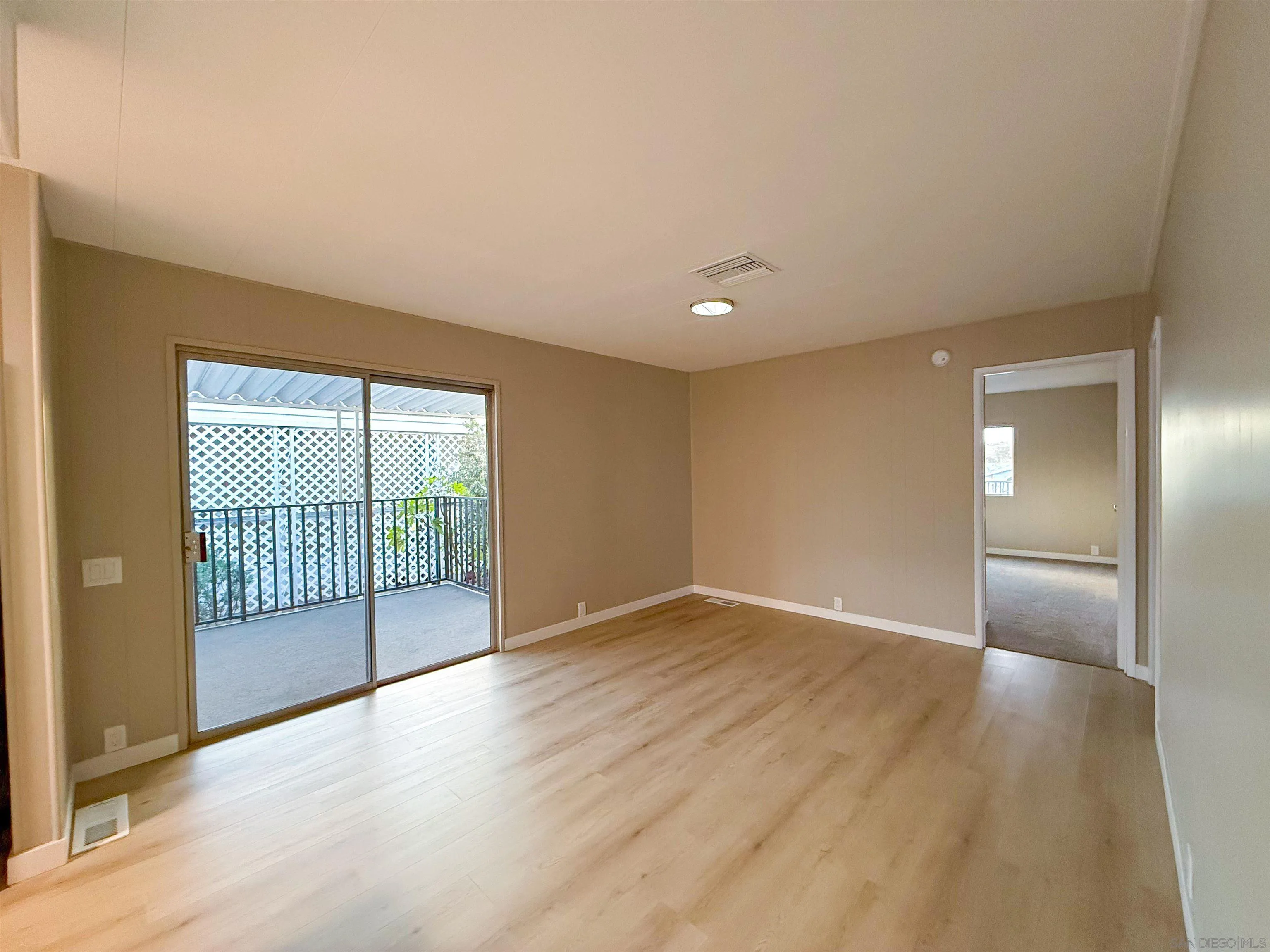 1212 H Street Ramona, CA 92065 - Photo 18 of 31 a view of empty room with wooden floor