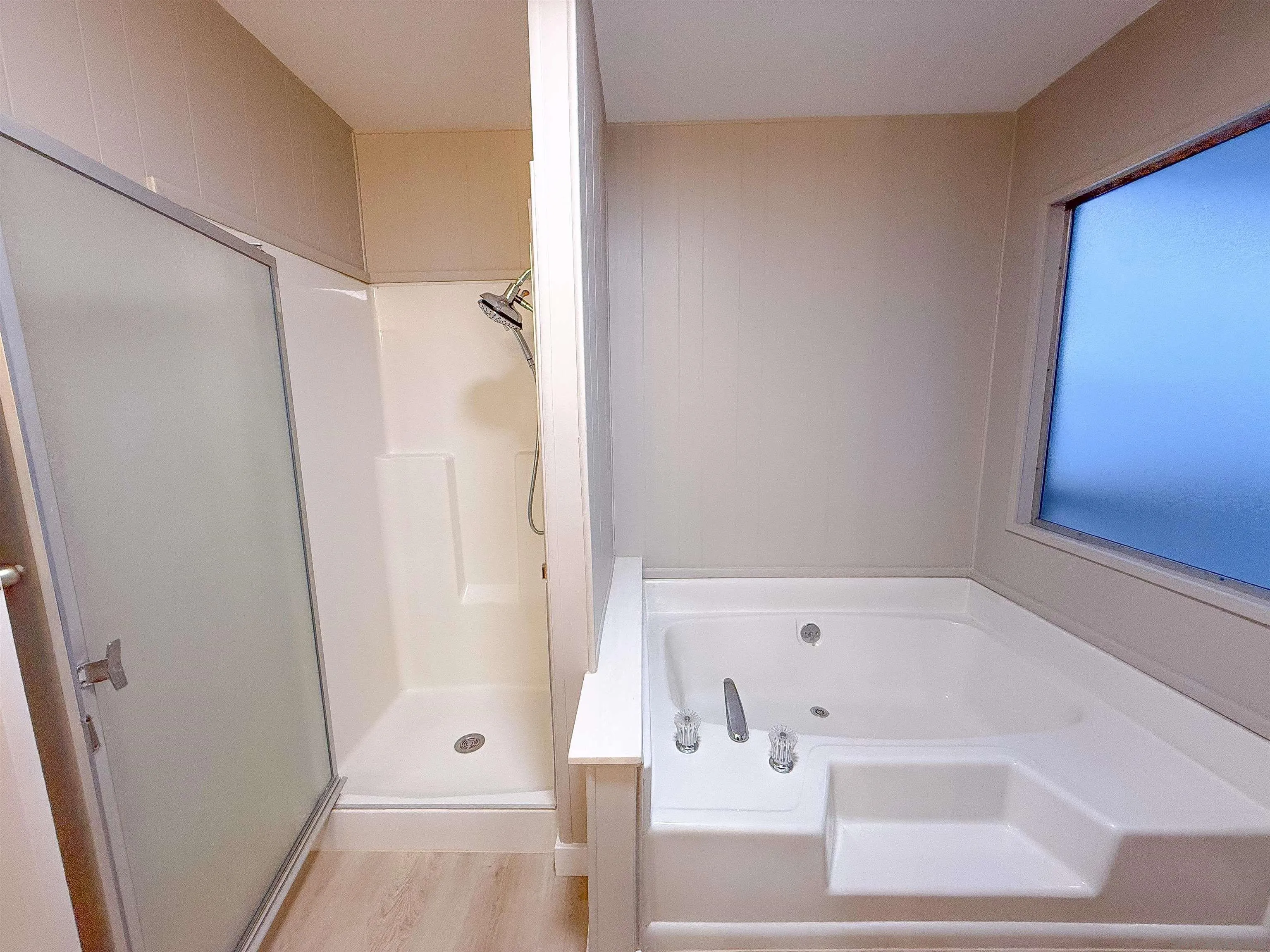 1212 H Street Ramona, CA 92065 - Photo 24 of 31 a bathroom with a bathtub and a shower