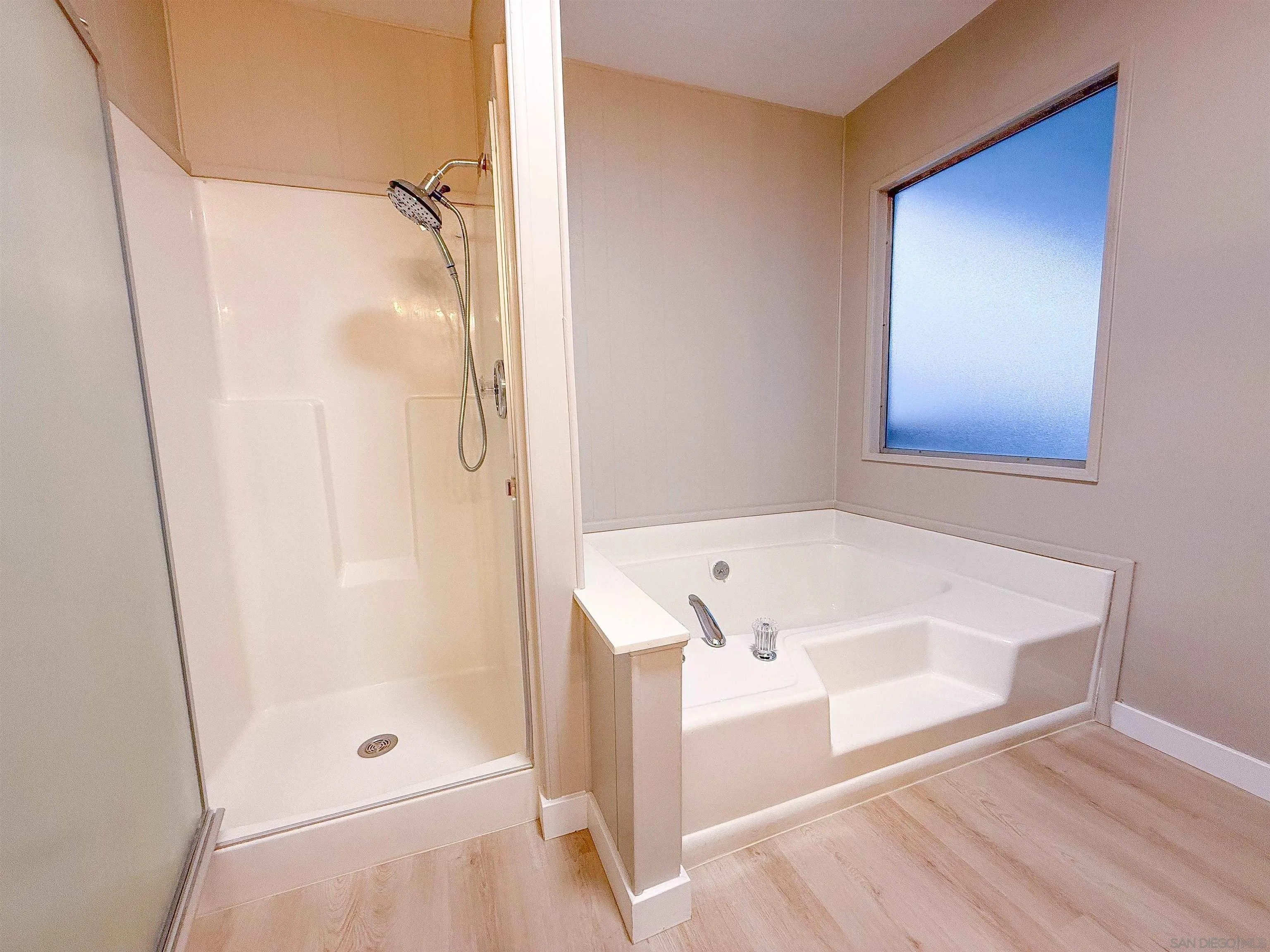 1212 H Street Ramona, CA 92065 - Photo 25 of 31 a bathroom with a bath tub and shower