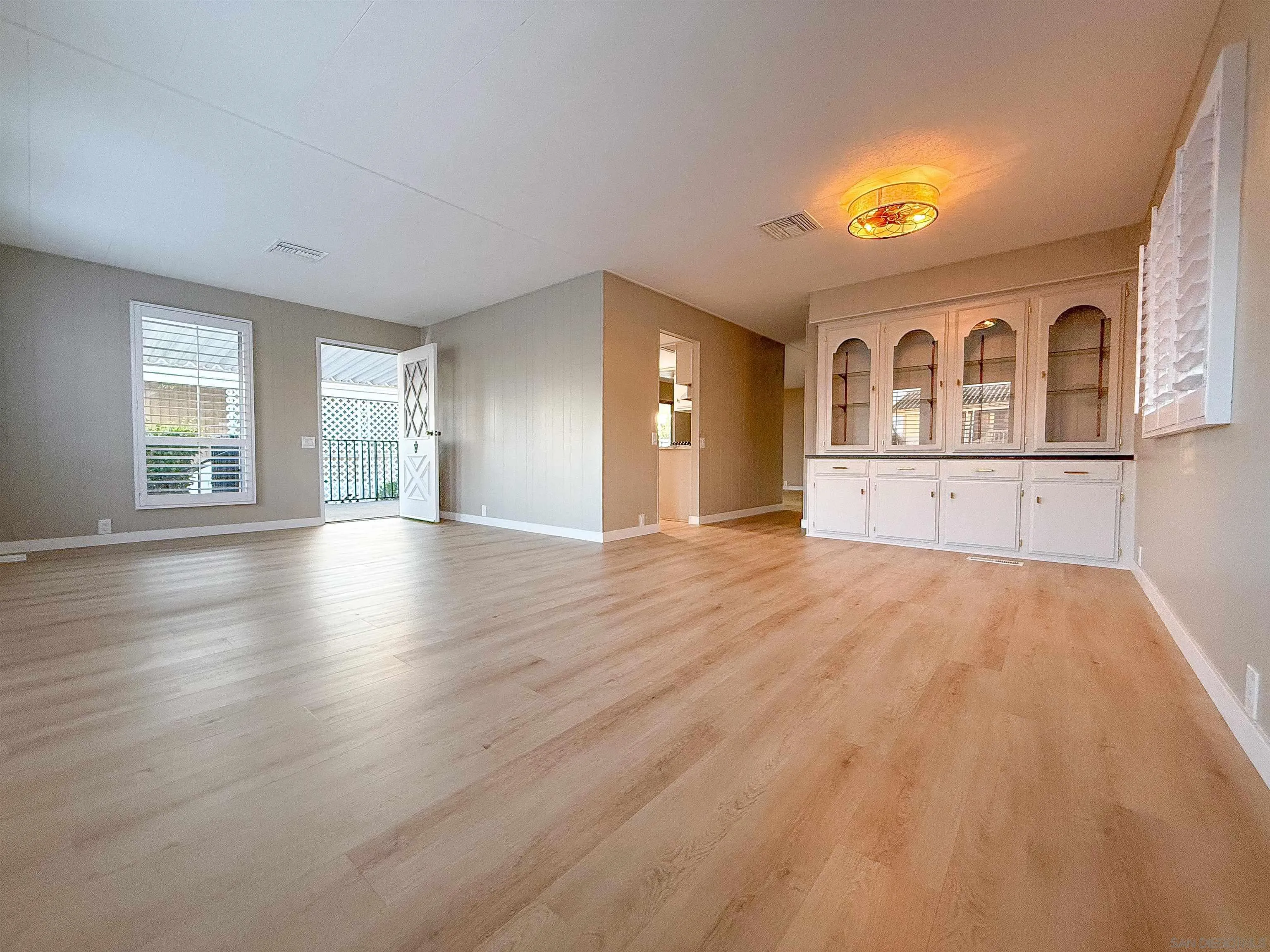 1212 H Street Ramona, CA 92065 - Photo 9 of 31 a view of empty room with wooden floor and fan