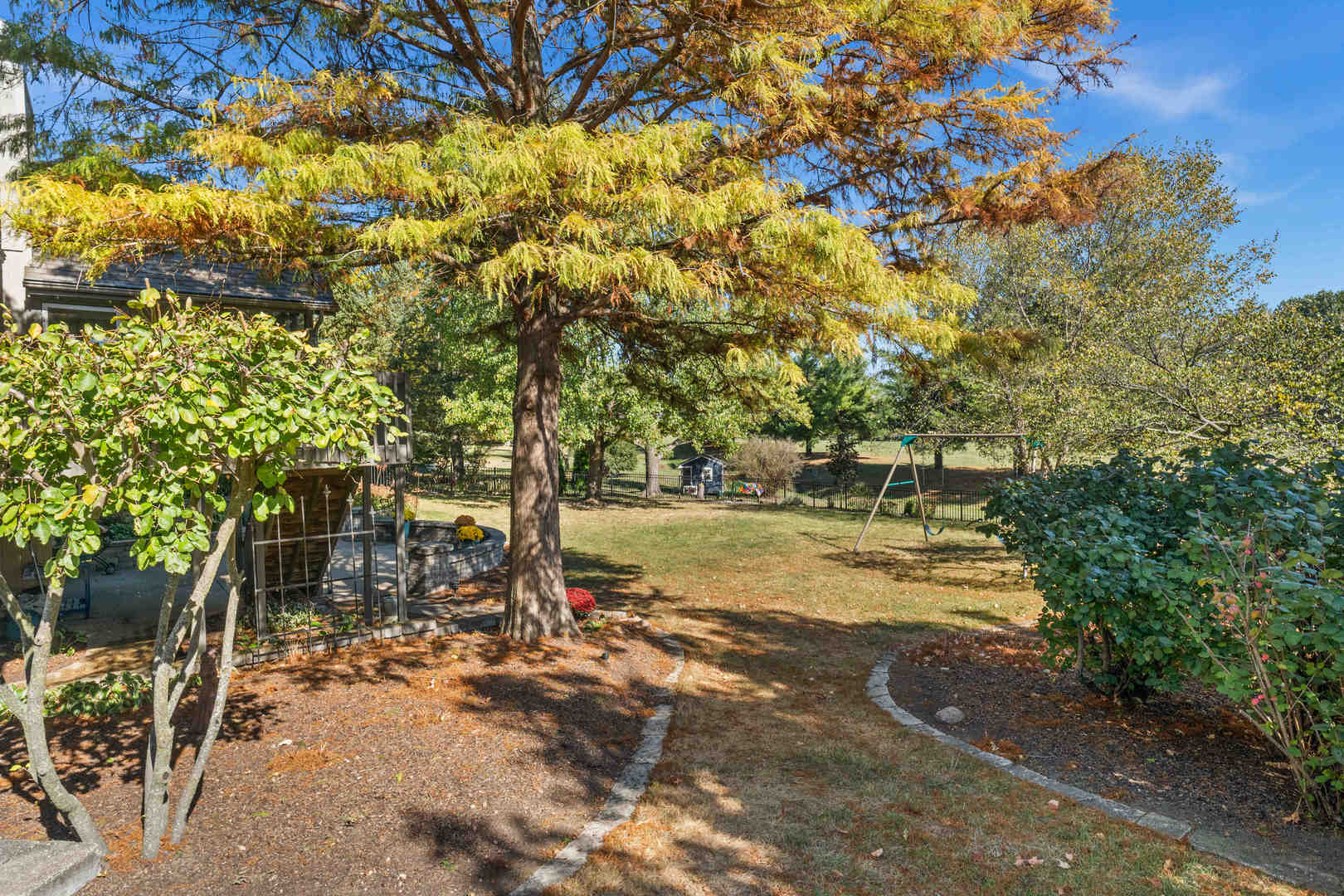 21 Pendleton Way Bloomington, IL 61704 - Photo 19 of 55 a view of yard with swimming pool and trees