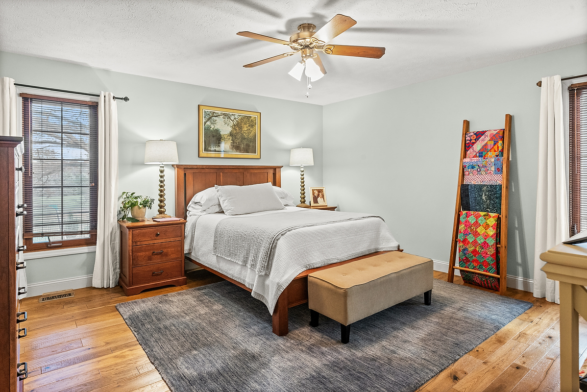 21 Pendleton Way Bloomington, IL 61704 - Photo 34 of 55 a bedroom with a bed and wooden floor