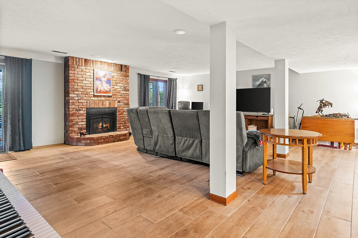 21 Pendleton Way Bloomington, IL 61704 - Photo 44 of 55 a living room with furniture and a flat screen tv