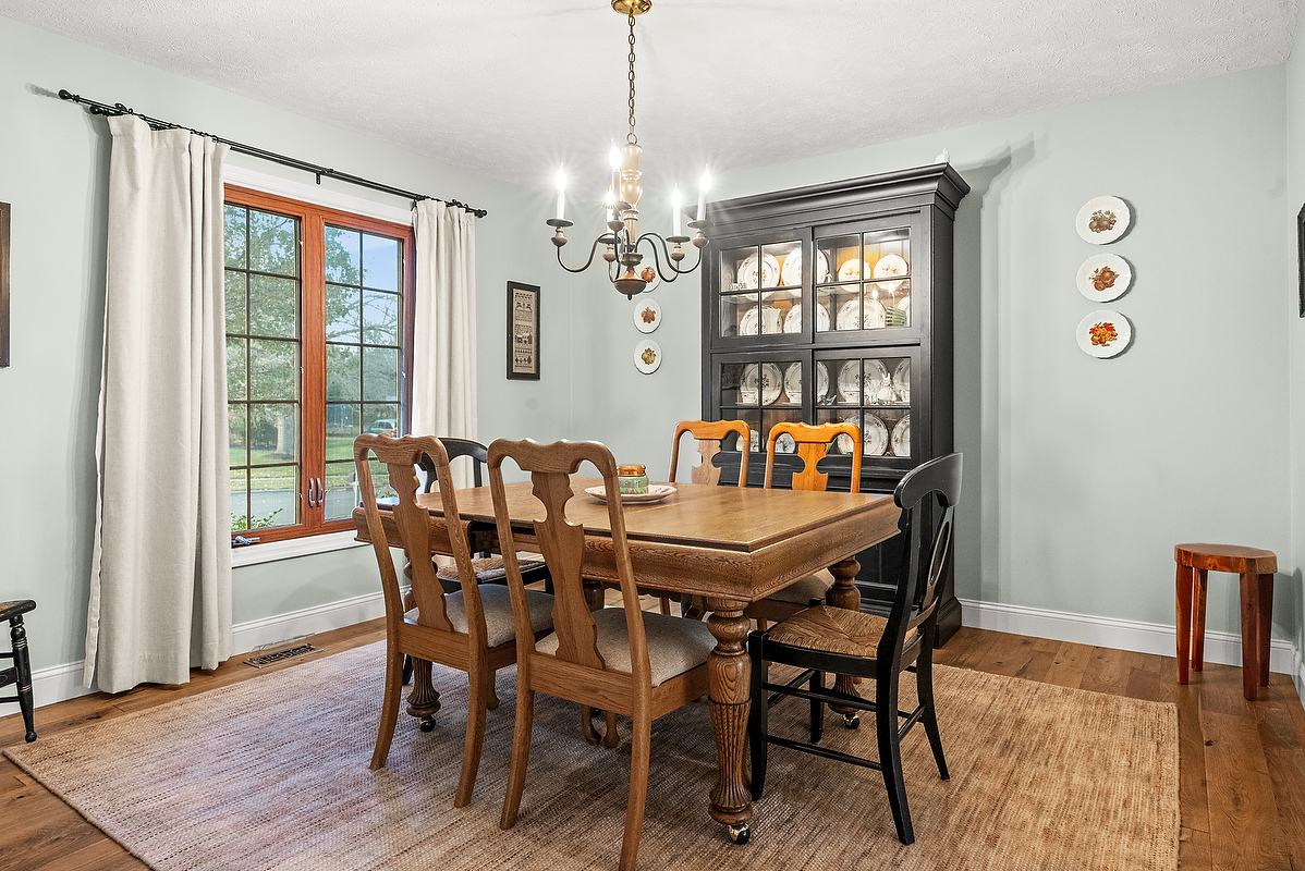 21 Pendleton Way Bloomington, IL 61704 - Photo 8 of 55 a view of a dining room with furniture window and wooden floor