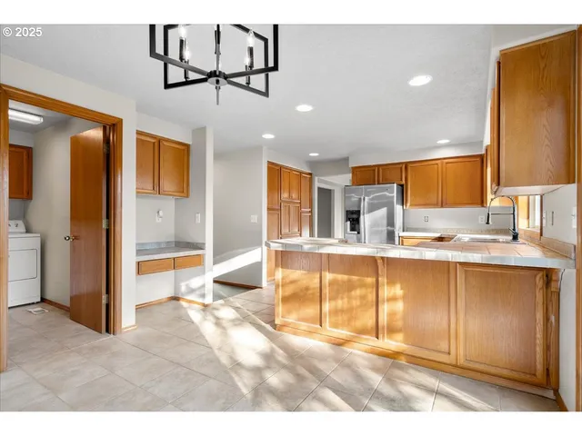 a spacious bathroom with a tub and mirror