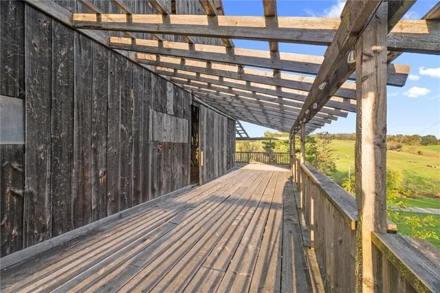 a view of a balcony with wooden floor